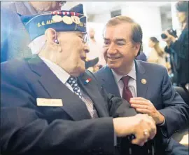  ?? Tom Williams CQ Roll Call ?? REP. ED ROYCE (R-Fullerton), right, chats with Celestino Almeda, a veteran representi­ng the Philippine Commonweal­th Army, at a ceremony in Washington.