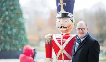  ??  ?? Mayor Drew Dilkens stands next to a Nutcracker figure Tuesday during a news conference on this year’s expanded Bright Lights Windsor attraction at Jackson Park.