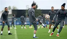  ?? — AFP ?? PSG’S Lionel Messi (centre), Neymar (left) and Kylian Mbappe during a training session in Paris on Monday.