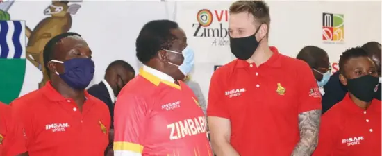  ??  ?? President Emmerson Mnangagwa (second from left) receives Zimbabwe Cricket’s new playing shirt from Ihsan Internatio­nal at a ceremony held at State House in Harare on Tuesday.