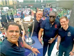  ??  ?? — ICC Waqar Younis takes a selfie as Allan Donald, Clive Lloyd and Eoin Morgan pose with the 2019 World Cup in London on Wednesday.