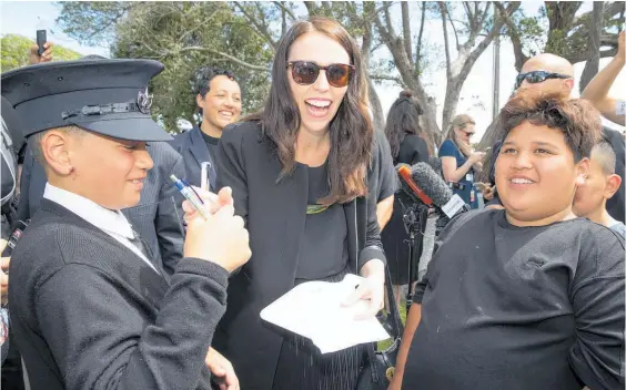  ?? Photo / Mark Mitchell ?? Jacinda Ardern took time to answer questions from children at the Rangitahi Village.