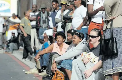  ?? Picture: SUNDAY TIMES ?? SYSTEM FAILURE: Unemployed people queue for UIF payments. Some beneficiar­ies that applied in April have still not been paid.