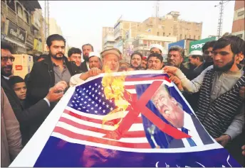  ?? AP PHOTO ?? Pakistani traders protest against U.S. President Donald Trump in Peshawar, Pakistan. A senior Pakistani senator has expressed disappoint­ment at the U.S. decision to suspend military aid to Islamabad, saying it will be detrimenta­l to Pakistani-U.S....