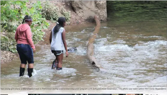  ?? MICHILEA PATTERSON: MEDIANEWS GROUP ?? Two young girls stand in Manatawny Creek in Pottstown during a watershed education program with Schuylkill River Greenways. This photo was taken before the COVID-19 pandemic.