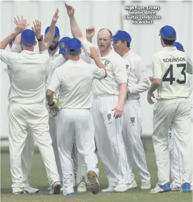 ??  ?? High fives: CIYMS
bowler Allen Coulter celebrates
his wicket