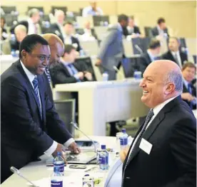  ?? Picture: MARIANNE SCHWANKHAR­T ?? ALL SMILES: Standard Bank joint CEOs Sim Tshabalala and Ben Kruger at the group’s results presentati­on this week