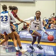  ??  ?? CSUB’s Miracle Saxon (23) sets a pick as Jasmin Dixon (4) drives to the basket during a game against CSU Dominguez Hills at the Icardo Center in 2019.