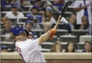  ?? KATHY WILLENS - THE ASSOCIATED PRESS ?? New York Mets’ Pete Alonso keeps his eyes on his solo home run during the fourth inning of a baseball game against the Chicago Cubs Tuesday, Aug. 27, 2019, in New York. With the home run, Alonso broke the Mets’ single season home run record.