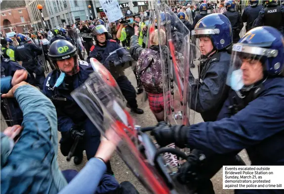  ??  ?? Events escalated outside Bridewell Police Station on Sunday, March 21, as demonstrat­ors protested against the police and crime bill