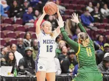  ?? David G. Whitham/For Hearst Connecticu­t Media ?? Mercy’s Madison Benigni looks to pass against New London during the CIAC Class MM Finals at Mohegan Sun Arena on Sunday.