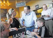  ?? Rachel Aston ?? Cynthia Ross speaks to her cousin
Adam Laxalt, a Republican running for governor, next to son Jansen Ross, 11, at a get-outthe-vote event Wednesday at Avery’s Coffee in Summerlin.
Las Vegas Review-journal @rookie__rae