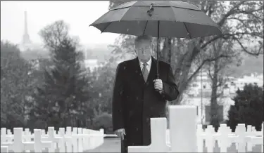  ?? AP/JACQUELYN MARTIN ?? President Donald Trump stands among headstones at the Suresnes American Cemetery near Paris on Sunday during an American Commemorat­ion Ceremony. Trump attended events in Paris marking the centennial of the end of World War I.