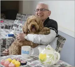  ??  ?? Jim Reilly with Cockapoo Cooper