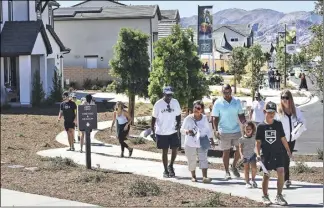  ?? Dan Watson/ The Signal ?? Visitors tour the 15 model homes during the Williams Ranch grand opening celebratio­n in Valencia.