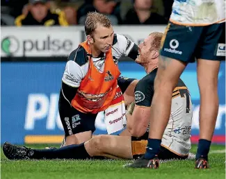  ?? GETTY IMAGES ?? Wallabies and Brumbies flanker David Pocock receives treatment for an injury during the match against the Highlander­s in Dunedin on Saturday night.