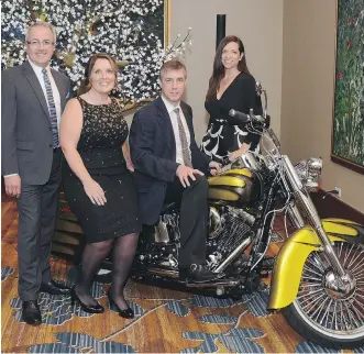  ?? PHOTOS: STUART GRADON ?? From left, at Wood’s Homes Never Give up Gala held Sept. 12 at the Hyatt are emcee Global Calgary’s Paul Dunphy, gala chair Kata Acheson, gala keynote speaker Markus Koenig and Canada Safeway director of community investment Renee Hopfner. Safeway was...