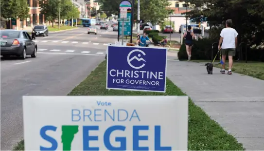  ?? (Reuters) ?? ELECTIONS SIGNS for Democratic Party gubernator­ial primary candidates are seen in Burlington, Vermont.