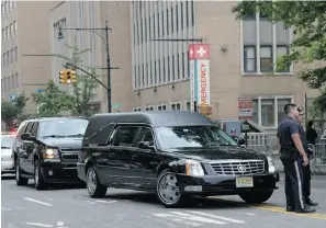  ?? Mike Coppolla/getty Images ?? A hearse enters a side entrance at the funeral for actor James Gandolfini in New York City on Thursday. He died June 19 while vacationin­g in Rome.