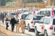  ?? REUTERS ?? ▪ Internatio­nal Committee of the Red Cross convoy seen crossing into eastern Ghouta near Wafideen camp in Damascus.