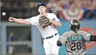  ?? Harry How Getty Images ?? COREY SEAGER’S THROWING arm was a concern late in the 2017 season and during spring training. The third-year shortstop said his elbow feels healthy and strong.