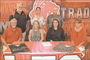  ?? (Photo by Scott Herpst) ?? Among the many on hand to watch Chelsey Lindsay (seated, second from left) sign her letter of intent to play softball for Talladega (Ala.) College were Mark Lindsay, Talladega College head coach Allison Barbee and Elaine Lindsay. On the back row was...