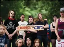  ?? —AFP ?? MINNEAPOLI­S: Protesters gather in Loring Park on Saturday.