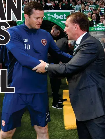  ??  ?? Interim Hearts manager Jon Daly shakes hands with Celtic manager Brendan Rodgers after Saturday’s match