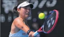  ?? AP ?? Wang Yafan plays a backhand return to compatriot Zheng Qinwen during their Australian Open thirdround match on Jan 20.