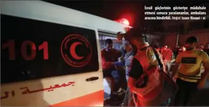  ?? Fotoğraf: Issam Rimawi - aa ?? İsrail güçlerinin gösteriye müdahale etmesi sonucu yaralananl­ar, ambulans aracına bindirildi.