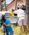  ?? COURTESY ?? TV cameramen and reporters stand in the middle of protected sea oats Saturday.