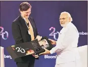  ?? BLOOMBERG ?? Bloomberg editor-in-chief John Micklethwa­it with PM Narendra Modi at the Bloomberg India Economic Forum 2016