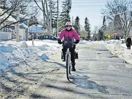  ?? SPECIAL TO THE EXAMINER ?? With preparatio­n and planning, winter cycling can be an active, safe, and fun part of your day, whether you’re walking the kids to school, commuting, or heading out for groceries.