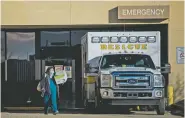  ?? ADRIA MALCOLM/NEW YORK TIMES ?? An ambulance is parked outside an Indian Health Service facility in Acoma Pueblo last month. Faced with a budget problem, the federal agency reduced the long-establishe­d hospital to a clinic.