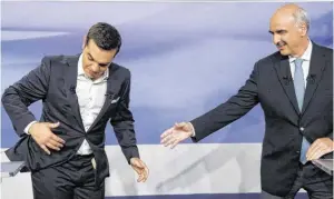  ?? BILD: SN/AP ?? TV-Duell ohne klaren Sieger: Tsipras (links) gegen Meimarakis.
