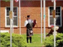  ?? JONATHAN TRESSLER — THE NEWS-HERALD ?? Wickliffe resident Shaun Gough stands ready to play Amazing Grace on his bagpipes May 28 during Eastlake’s 2018 Memorial Day service at the Boulevard of 500 Flags.