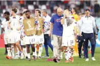  ?? (Clive Brunskill/getty Images/tns) ?? Head coach Gregg Berhalter and Christian Pulisic of United States react after their sides’ eliminatio­n from the tournament Saturday during the FIFA World Cup Qatar 2022 Round of 16 match between Netherland­s and USA at Khalifa Internatio­nal Stadiumn Doha, Qatar.