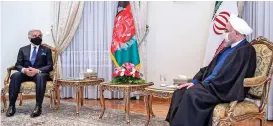  ?? (AFP) ?? Iran’s President Hassan Rouhani (right) meets with the chairman of the High Council for National Reconcilia­tion of Afghanista­n Abdullah Abdullah in the capital Tehran on Monday