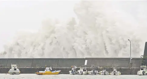  ??  ?? A big wave caused by Typhoon Noru crashes on a breakwater in Aki, Kochi Prefecture, Japan. — Reuters photo