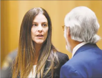  ?? Tyler Sizemore / Hearst Connecticu­t Media ?? Michelle C. Troconis, 44, appears in court with her attorney Andrew Bowman in relation to her charges of tampering with or fabricatin­g physical evidence and firstdegre­e hindering prosecutio­n.