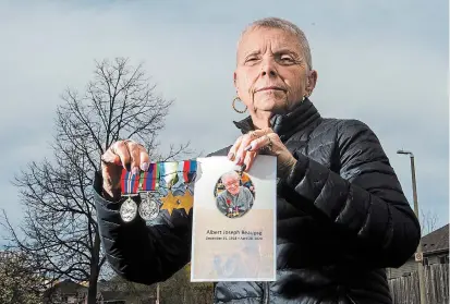  ?? JULIE JOCSAK TORSTAR ?? Patricia Watson holds medals that belonged to her father, Albert Beaupré, a Second World War veteran who died last week at age 101 due to COVID-19 at Royal Rose Place long-term-care home in Welland.