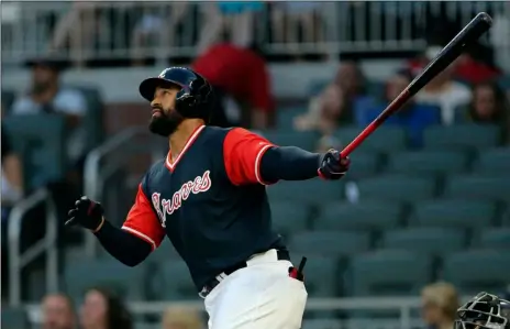  ??  ?? Atlanta Braves’ Matt Kemp watches the flight of a two-run home run during the first inning of a baseball game against the Colorado Rockies on Aug. 25 in Atlanta. Kemp is returning to the Los Angeles Dodgers as part of a five-player trade with the...