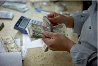  ?? Bloomberg ?? Egypt floated its currency a year ago, and the pound has roughly halved in value. —