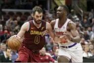  ?? TONY DEJAK — THE ASSOCIATED PRESS ?? Cavaliers forward Kevin Love drives past Knicks forward Noah Vonleh Feb. 11 in Cleveland.
