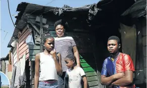  ??  ?? From left, Khanyisa, Solani, Victoria and Songayi Dave Rivele outside their small shack in Alex, Johannesbu­rg. Solani has her sights set on a plot in Waterfall. Inset: Gift Maboke.