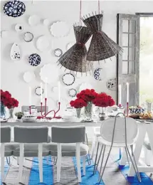  ?? CRATE AND BARREL ?? The woven willow shades of Crate & Barrel’s Como pendant lamps ($199.95 each) dangle like swinging straw hats from a bright red decorative cloth cord, warming the room with casual, natural charm and soft, diffused light.