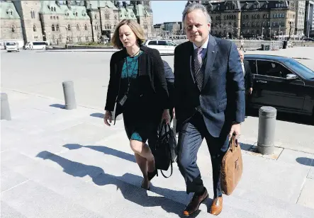  ?? THE CANADIAN PRESS/JUSTIN TANG ?? Governor of the Bank of Canada, Stephen Poloz, and Senior Deputy Governor Carolyn Wilkins arrive on Parliament Hill in April. If increased protection­ist measures result in higher prices, the central bank will be duty bound to stop the spread of inflation.