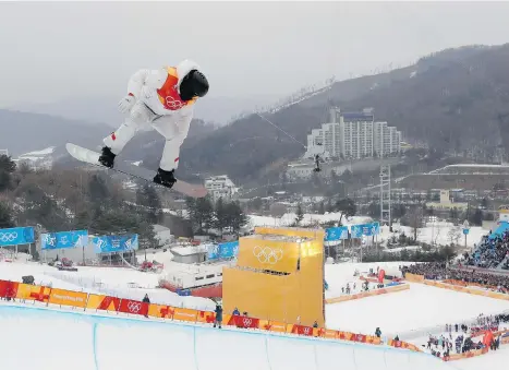 ?? KIN CHEUNG/THE ASSOCIATED PRESS ?? Shaun White of the United States soars during the men’s halfpipe finals at Phoenix Snow Park in Pyeongchan­g, South Korea, on Wednesday. He has now won three Olympic halfpipe gold medals.