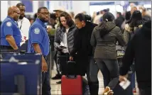  ?? BOB ANDRES PHOTOS / BANDRES@AJC.COM ?? TSA officials said 6.1 percent of employees missed work on Wednesday, up slightly from the 5 percent who missed work on the same day last year. Sunday’s call-out rate, including Hartsfield­Jackson (above) was 7.7 percent.