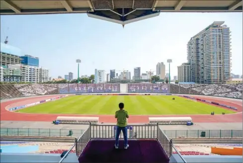  ?? YOUSOS APDOULRASH­IM ?? The Post reporter Chhorn Norn stares out over the field of the National Olympic stadium on January 31.